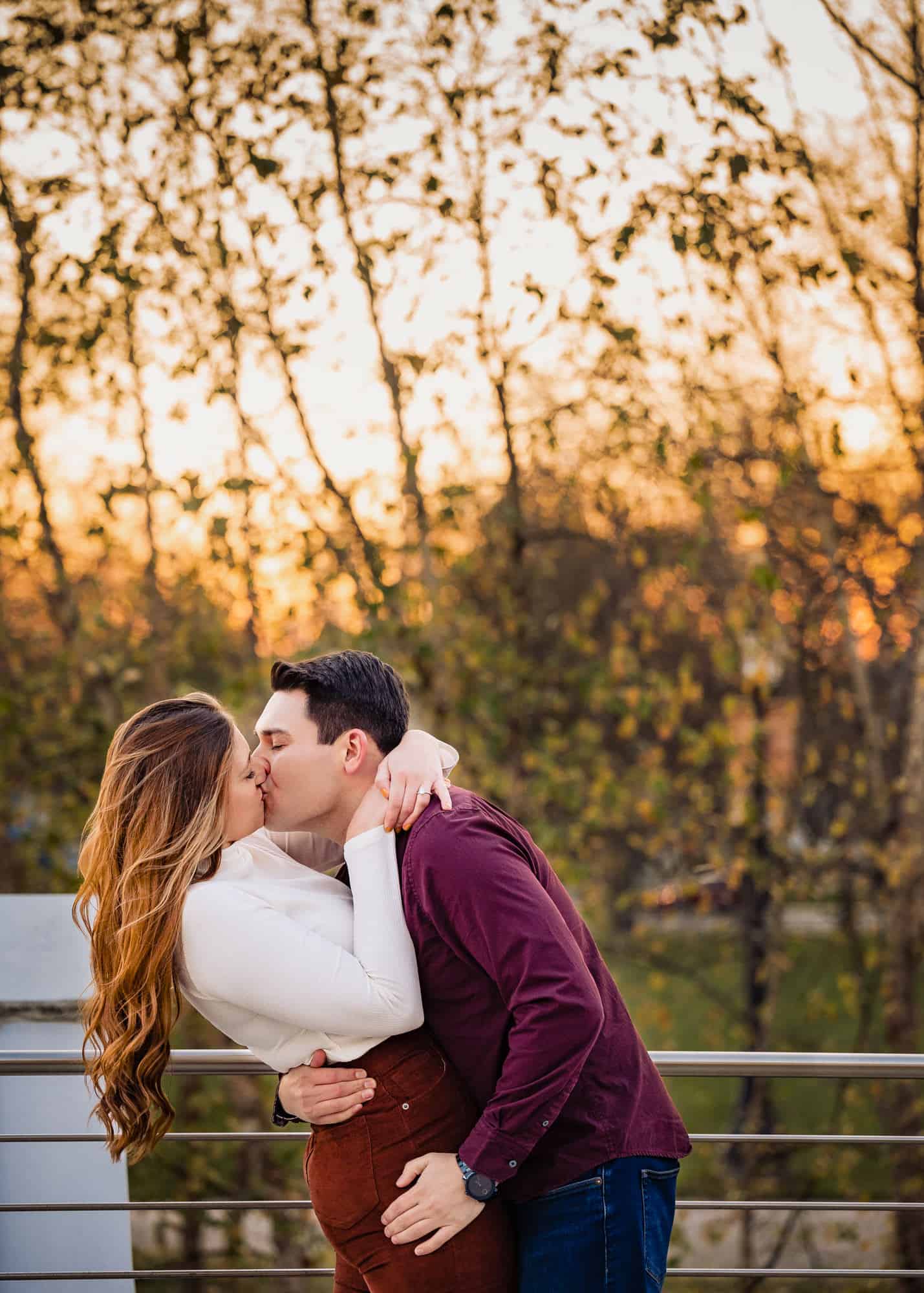 couple shares a kiss during their e-session