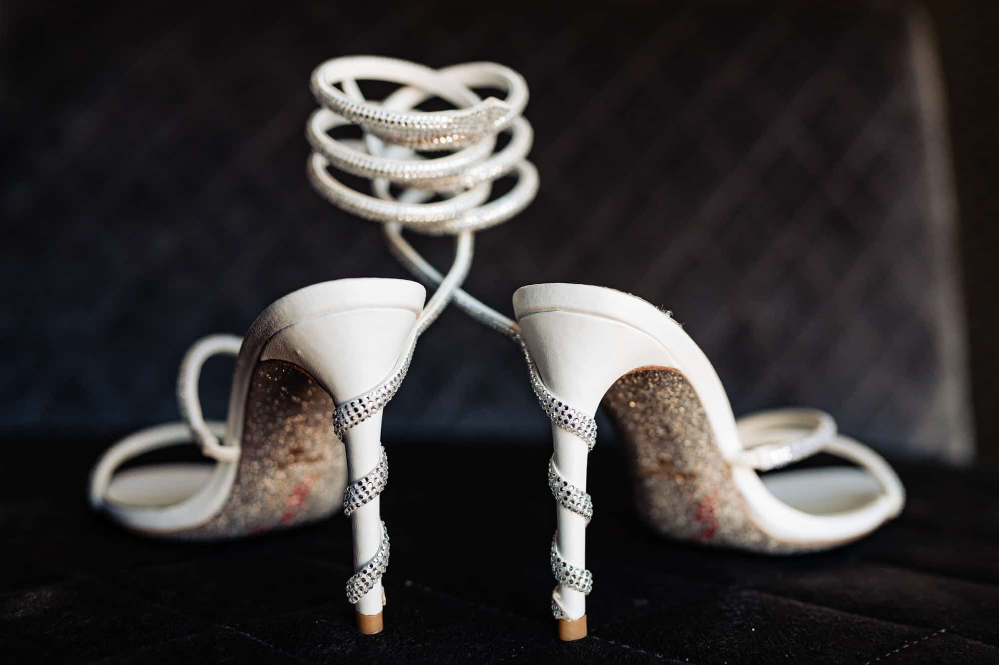 a pair of white bridal shoes