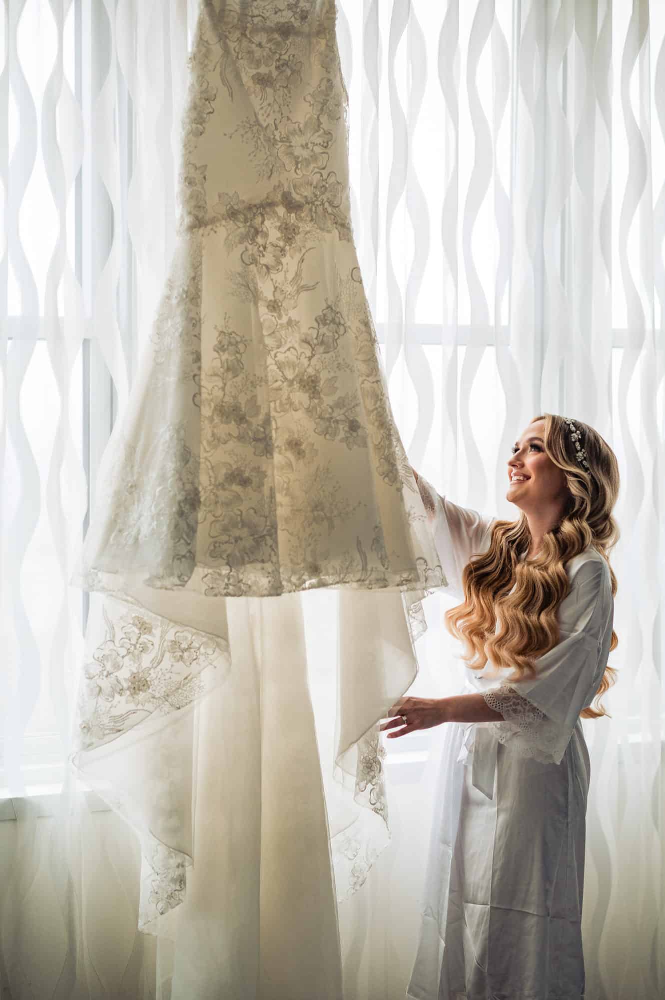 bride holding her wedding dress