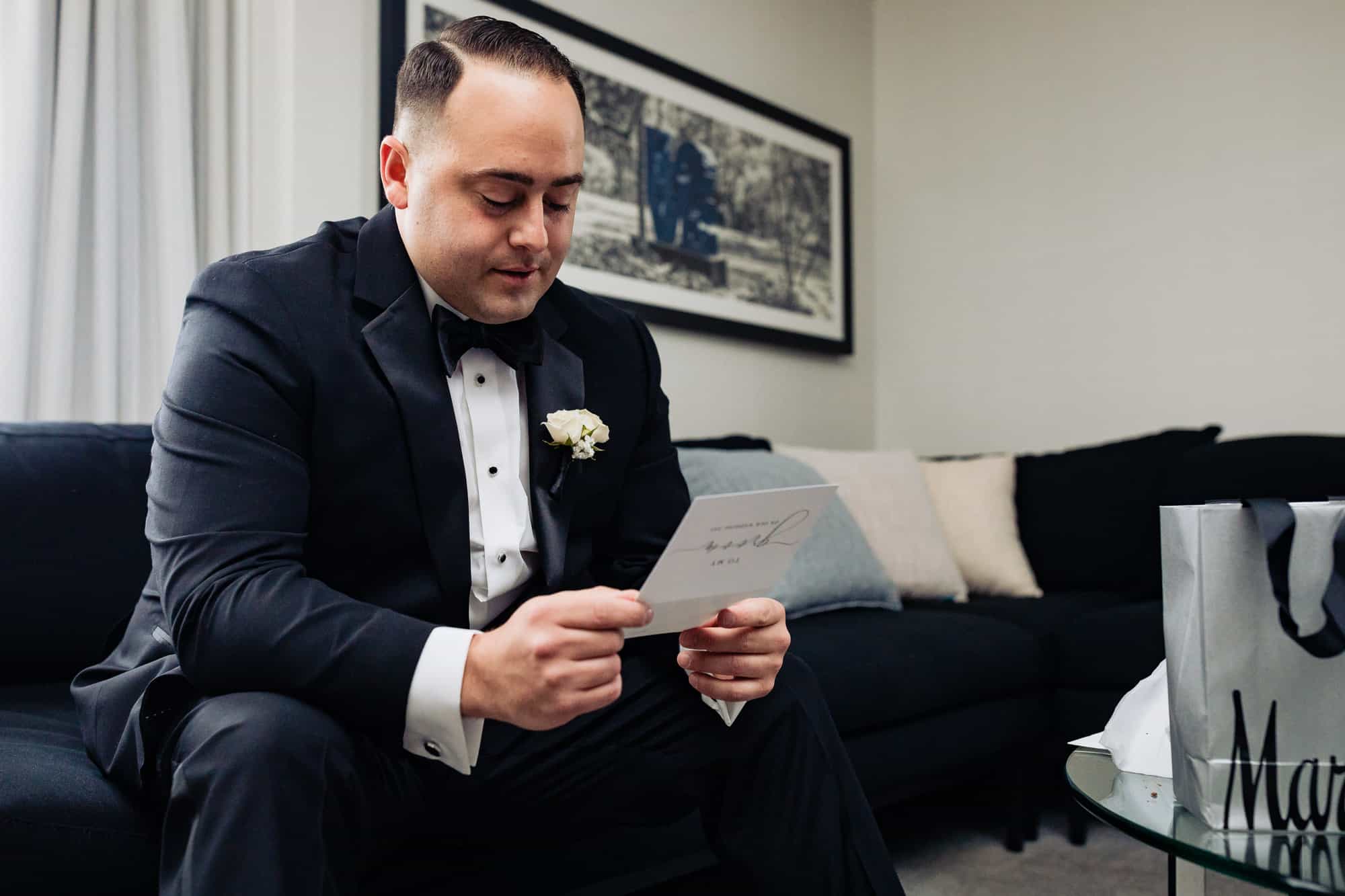 the groom reading the bride's letter for him