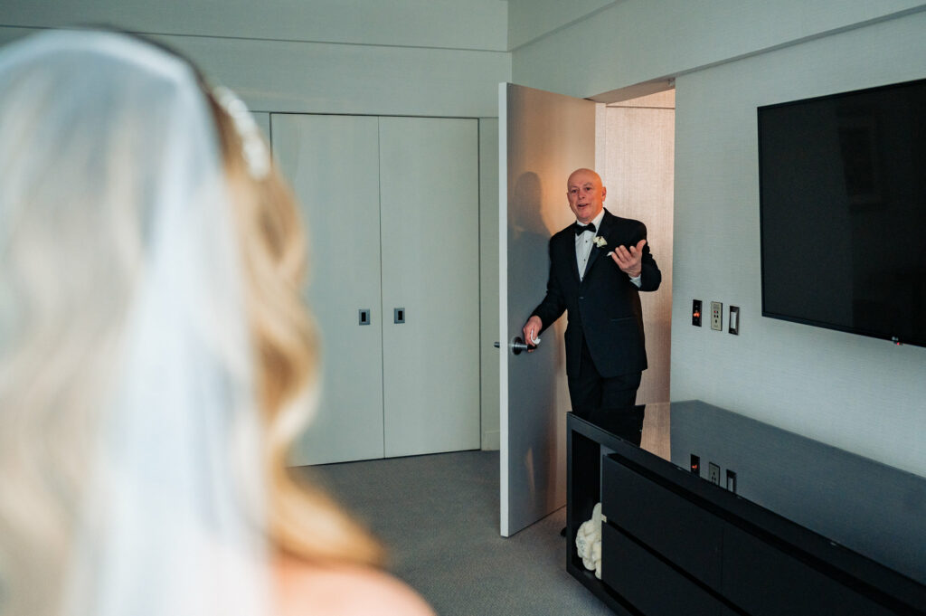 bride's father entering the bride's suite