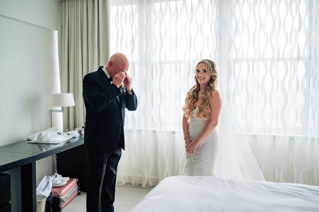 bride's father crying seeing her daughter getting married