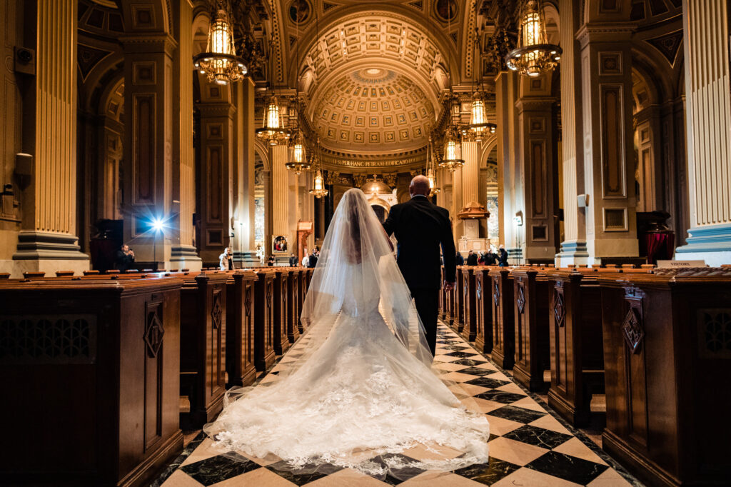 bride and her father walking on the aisle