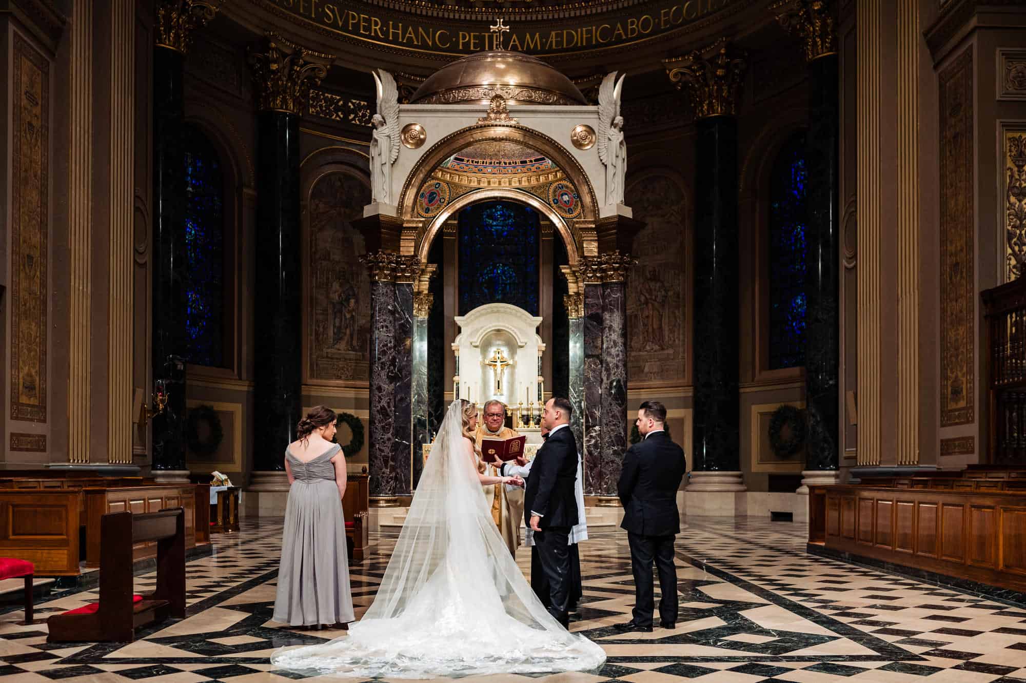 bride and groom in front of the altar