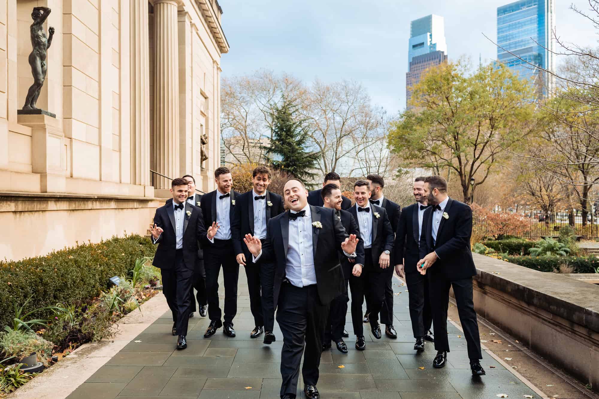 groom and groomsmen smiles for the camera