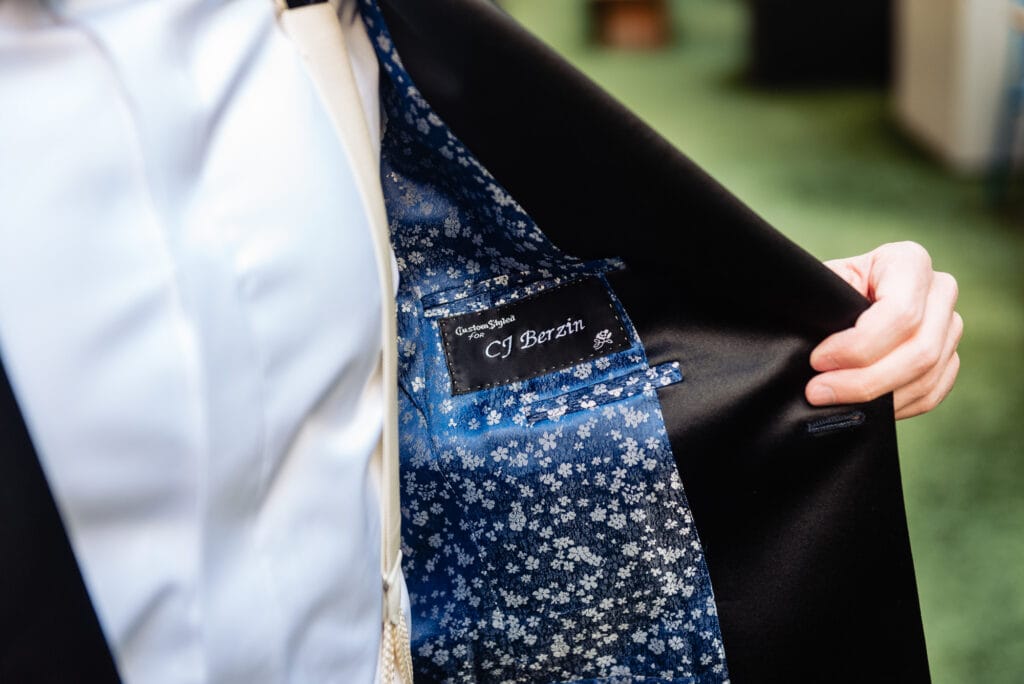 the groom's name embroidered on the inside of his wedding suit