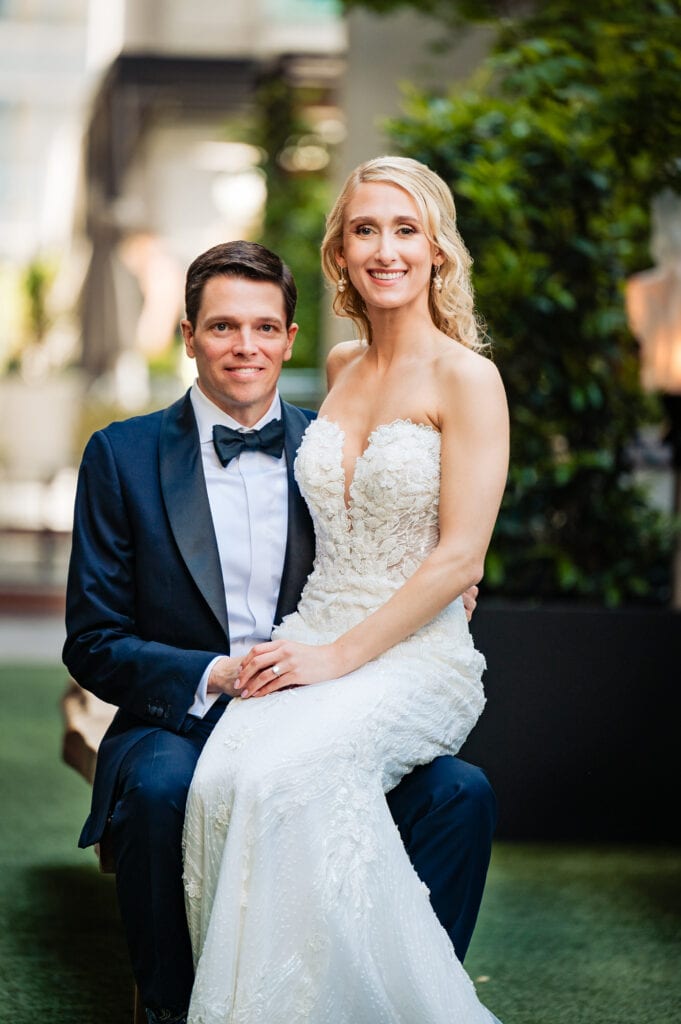 bride sitting on the groom's lap