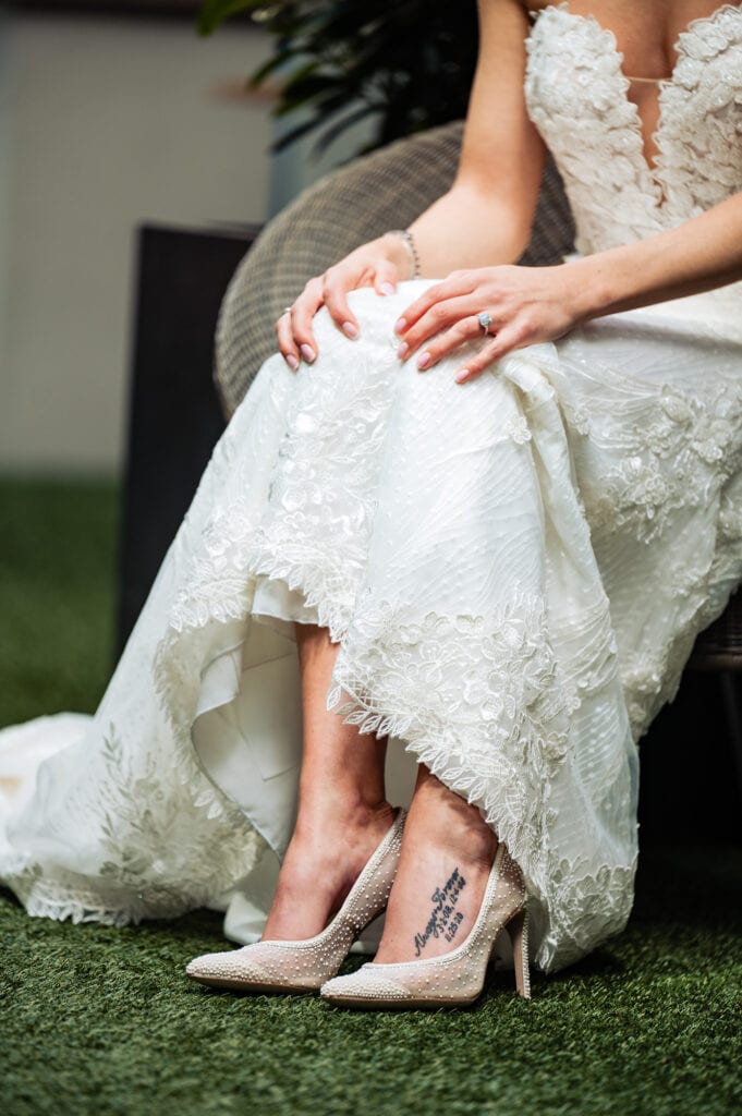 shot of the bride's foot tattoo