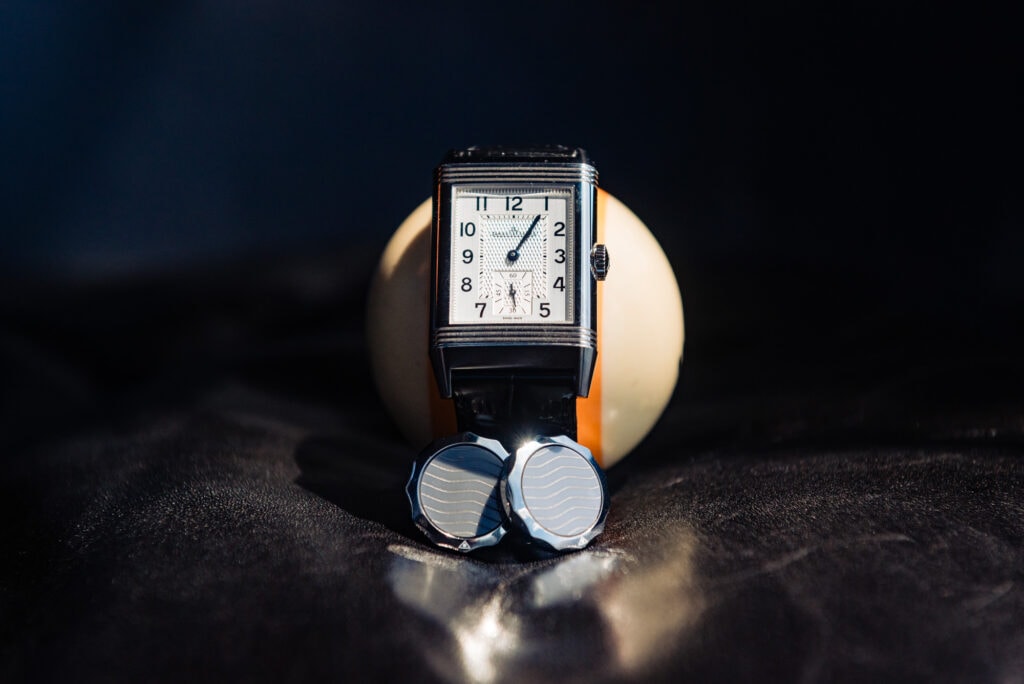 groom's watch and a pair of boutonnieres