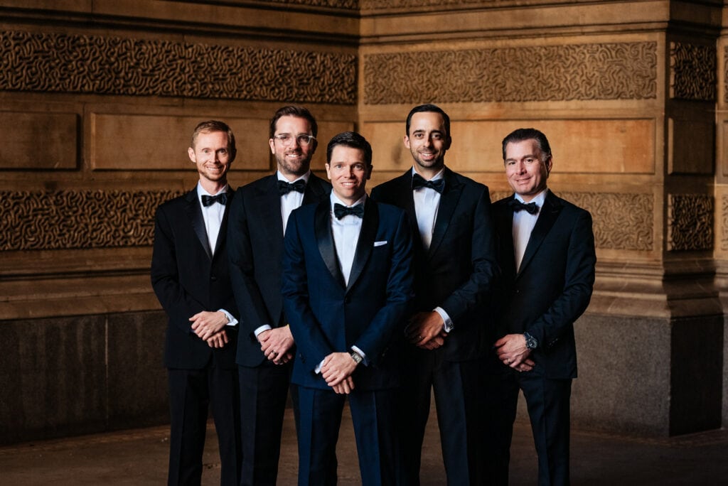 groom posing with groomsmen