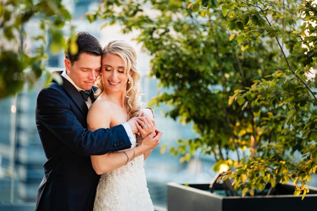 groom back hugging the bride