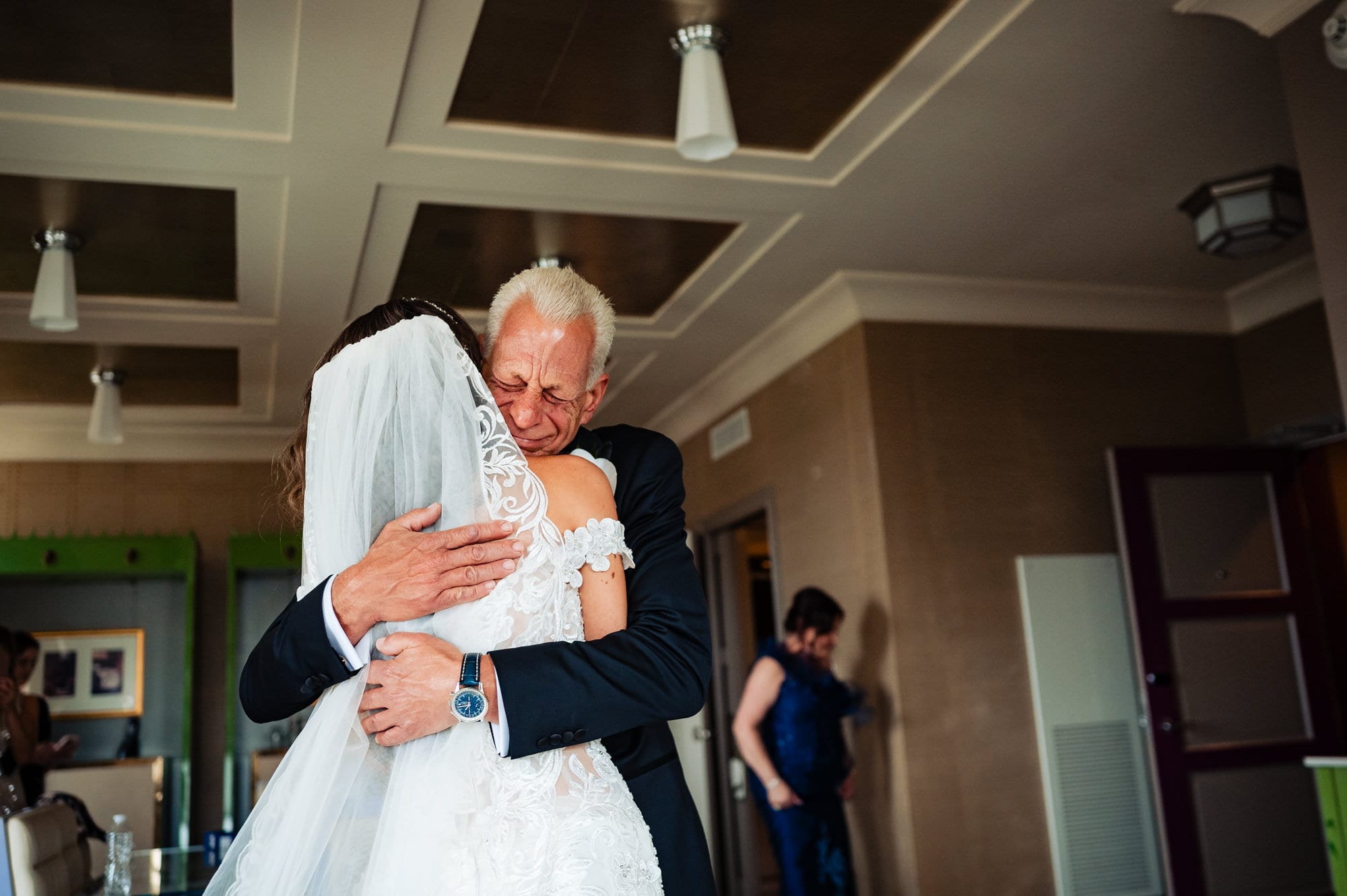 bride is hugging her father