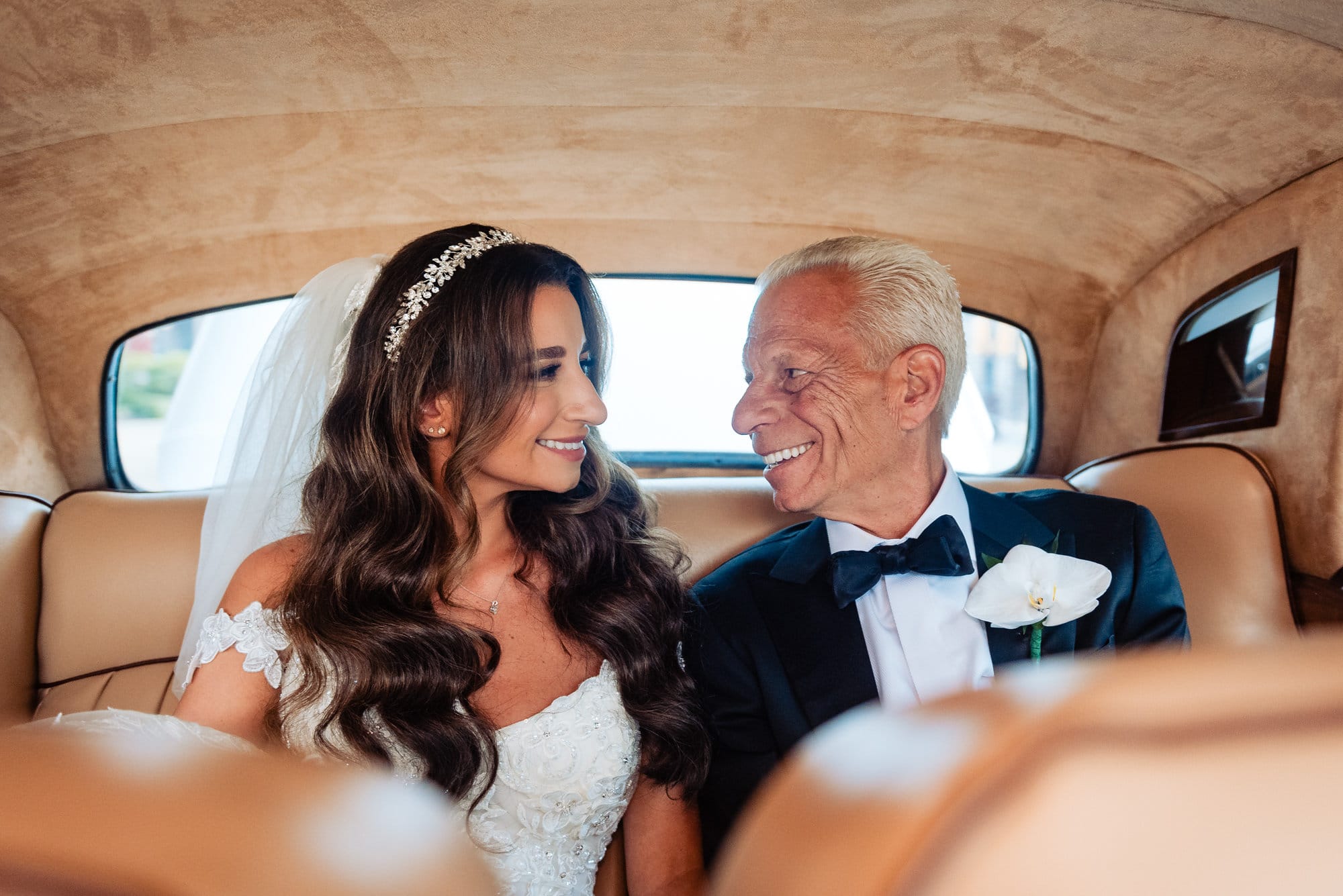 bride and her father inside the bridal car