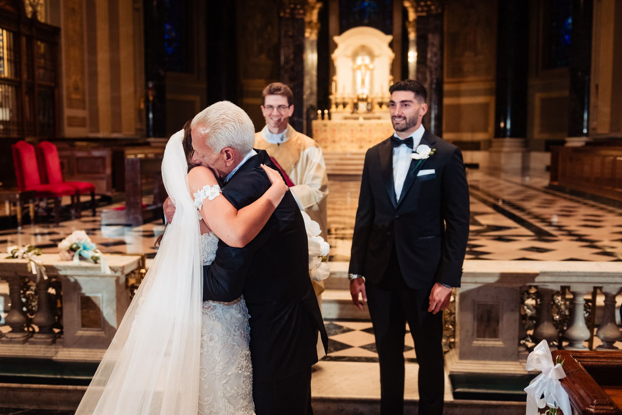 father is hugging his daughter before giving her to the groom