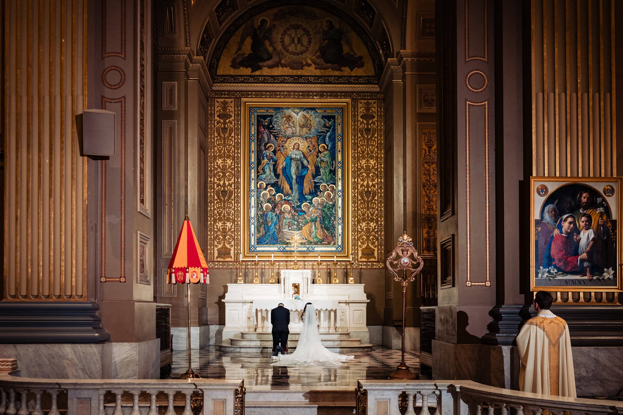 bride and groom standing at the altar