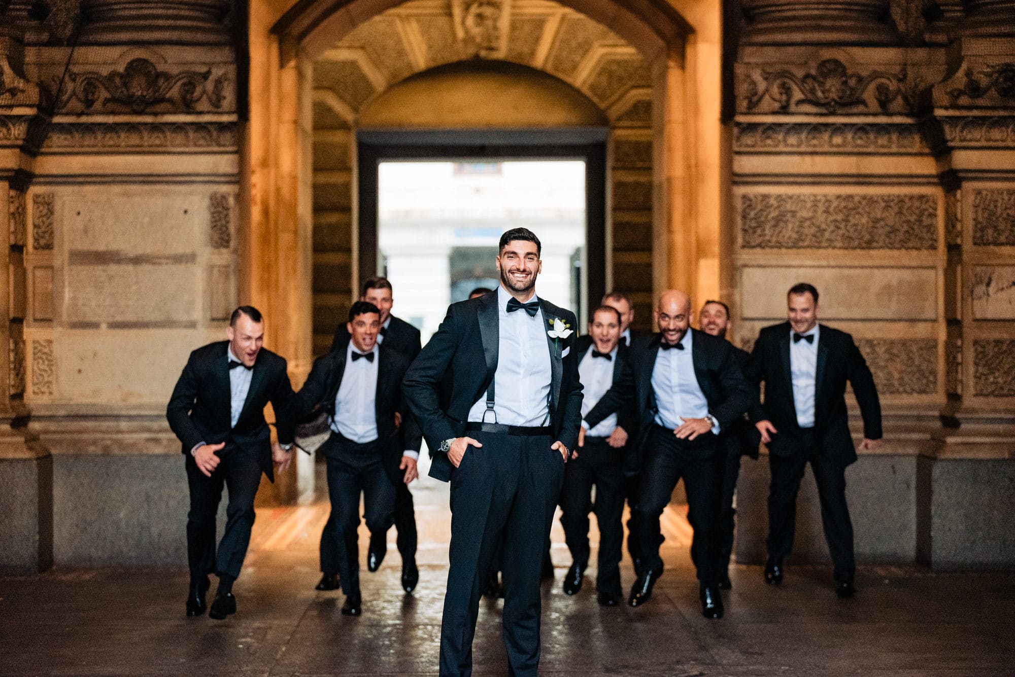 the groom and his groomsmen in their wacky pose