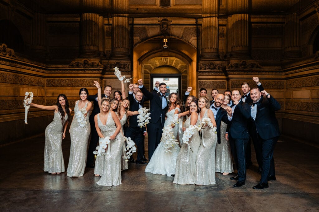 the newlyweds and their entire entourage in their wacky pose