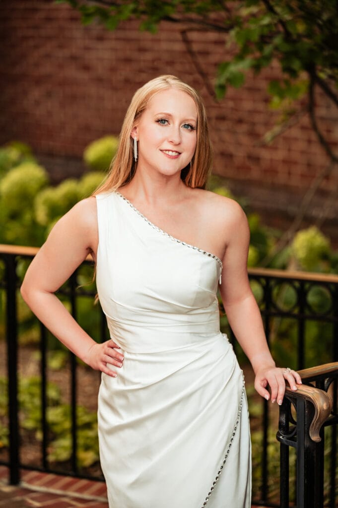 stunning bride-to-be in her white dress smiles for the camera