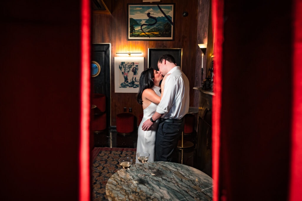 intimate moment between the couple as they hold each other and share a kiss