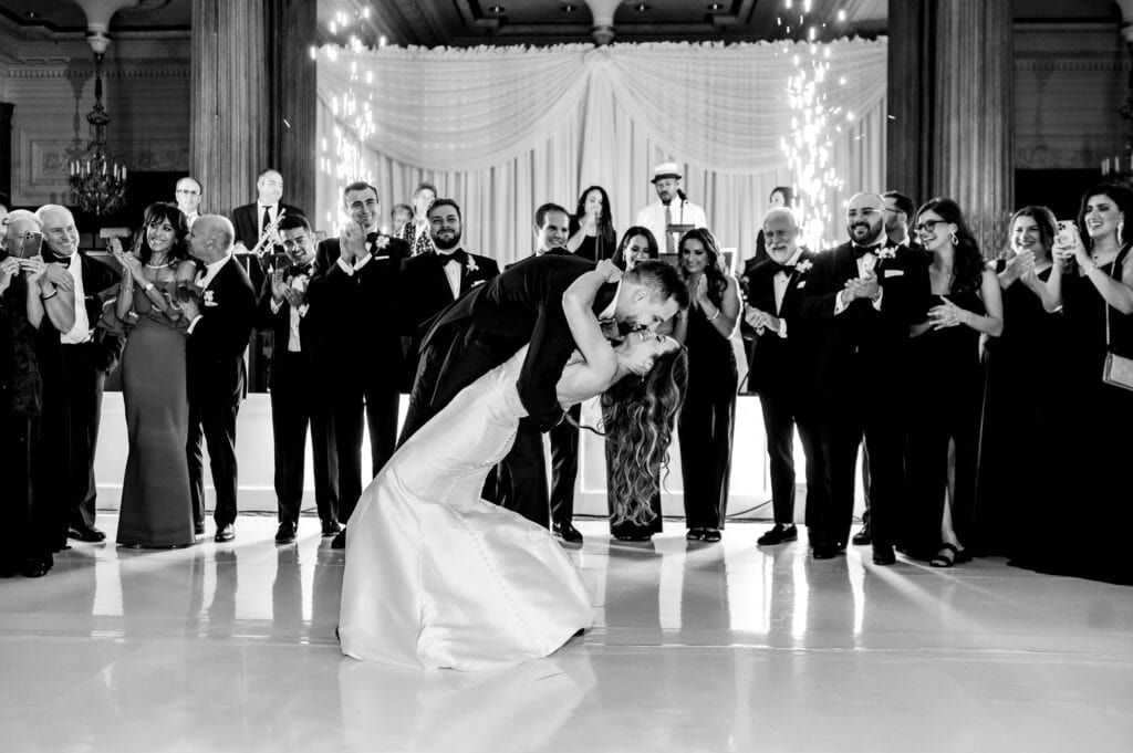 the newlyweds share a tender kiss during their first dance