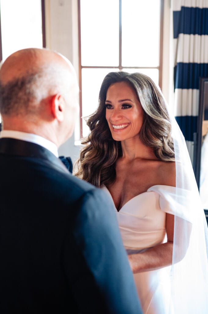 bride getting emotional after seeing her father