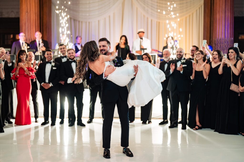 groom carrying the bride the bridal style way