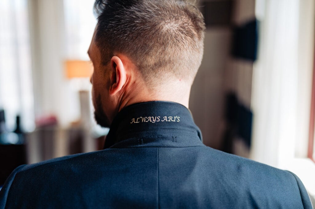 the back of the groom's collar embroidery of the phrase "ALWAYS ARI'S"