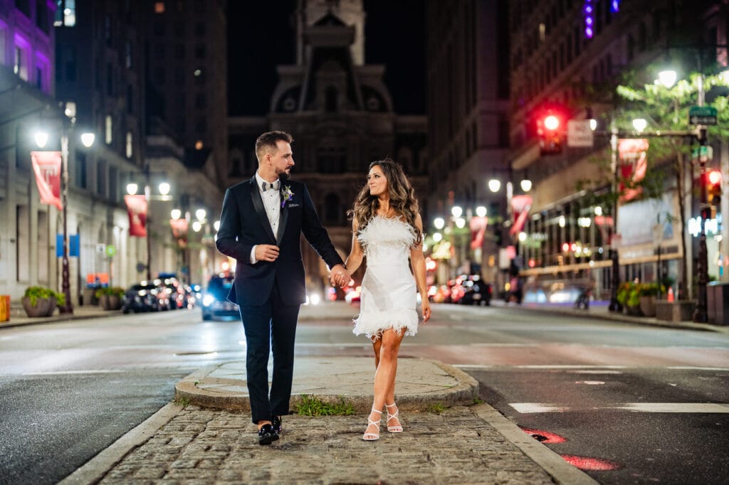 bride and grrom looking at each other in the middle of the streets