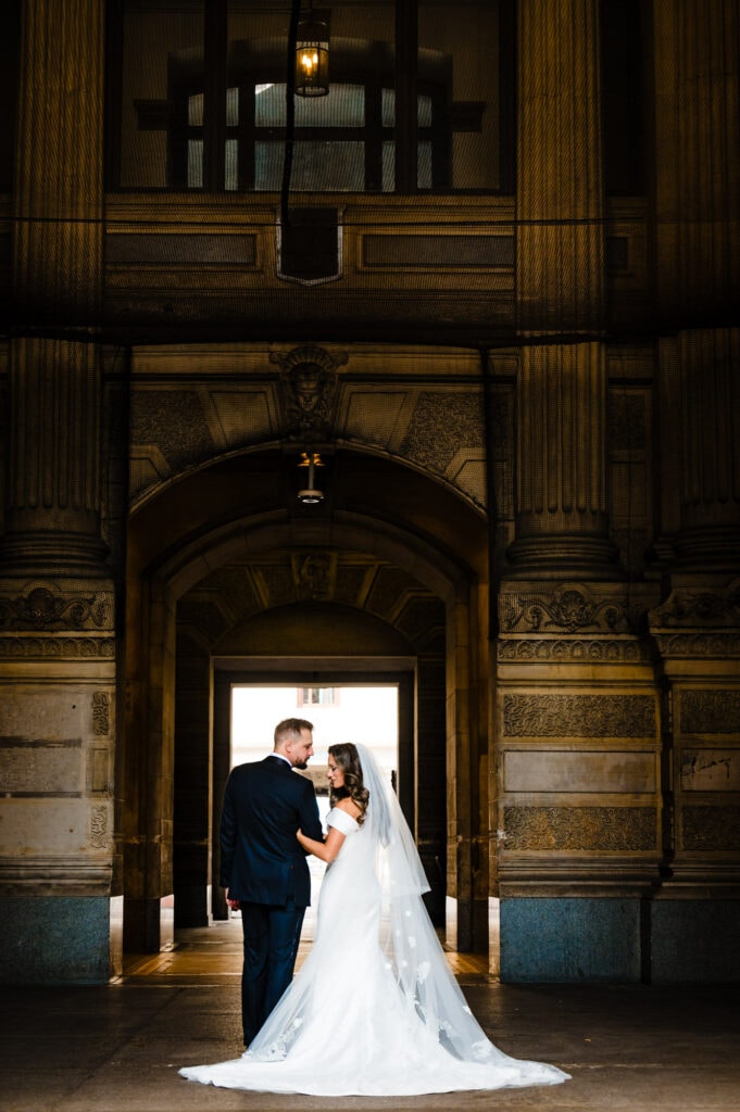 bride and groom share a pose after their first look