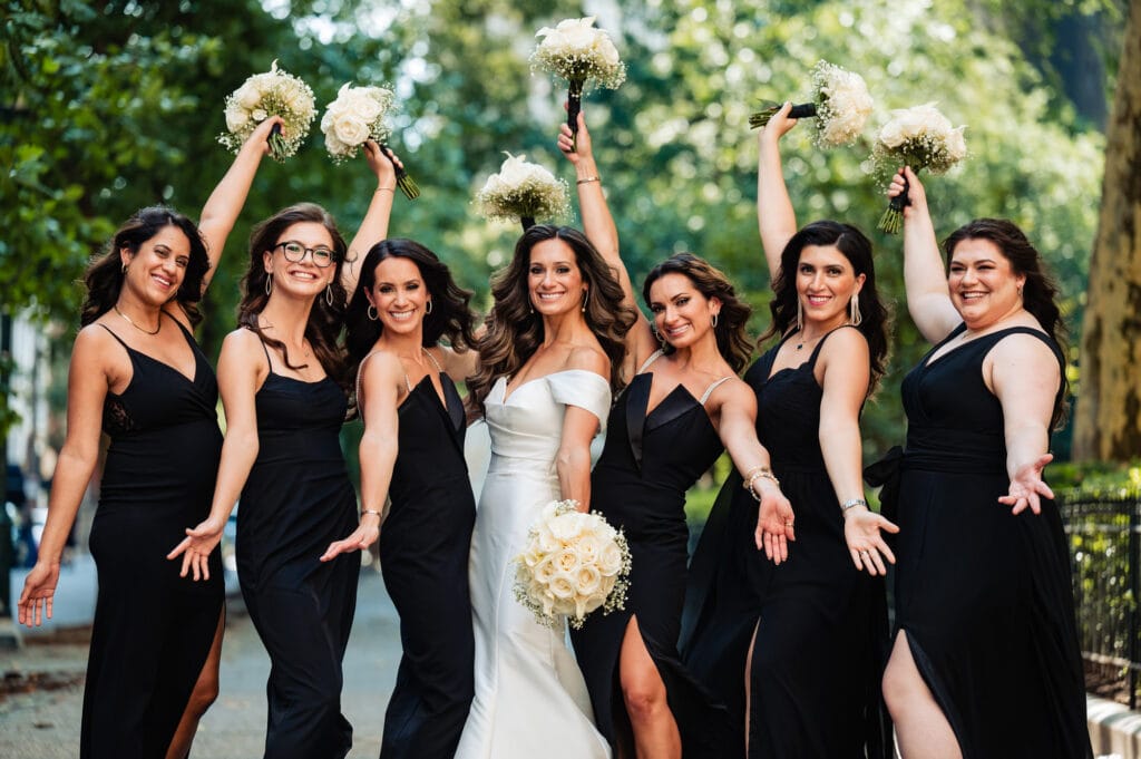 bride posing with the bridesmaids