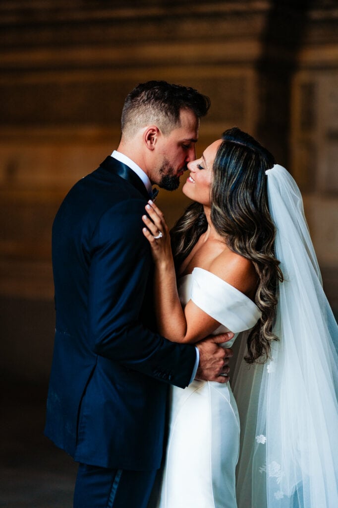 bride and groom leaning in for a kiss
