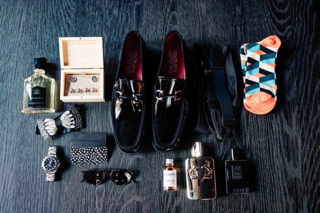 the groom's wedding shoes, accessories, socks, cologne, watch, and etc.