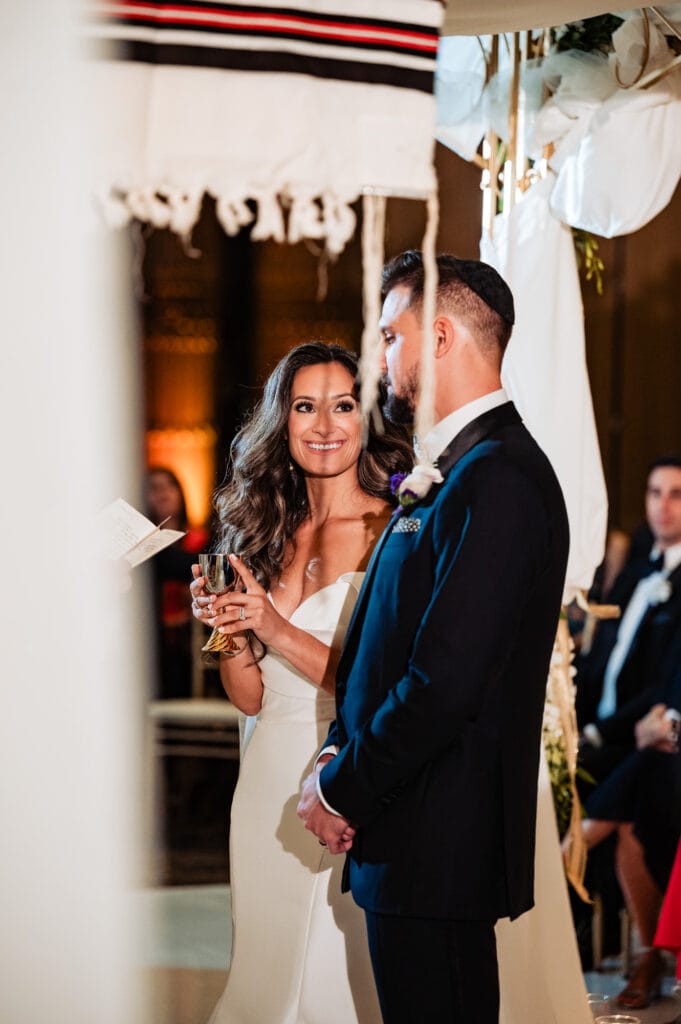 bride and groom listening intently to the wedding officiant