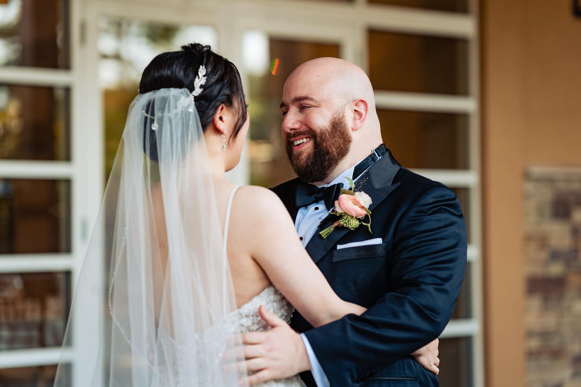 groom and bride had a light moment after their first look