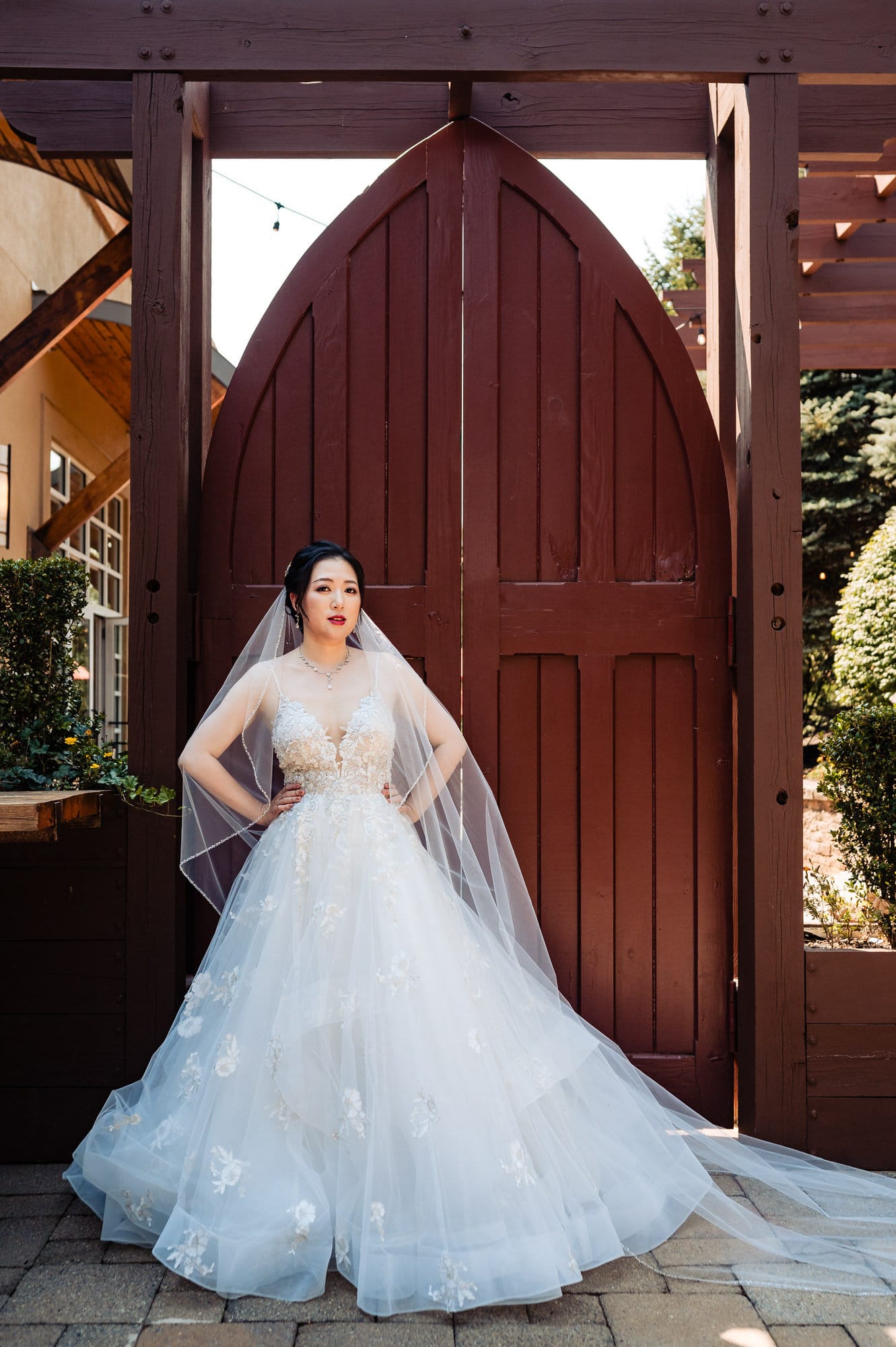 solo shot of the radiant bride in an outdoor garden