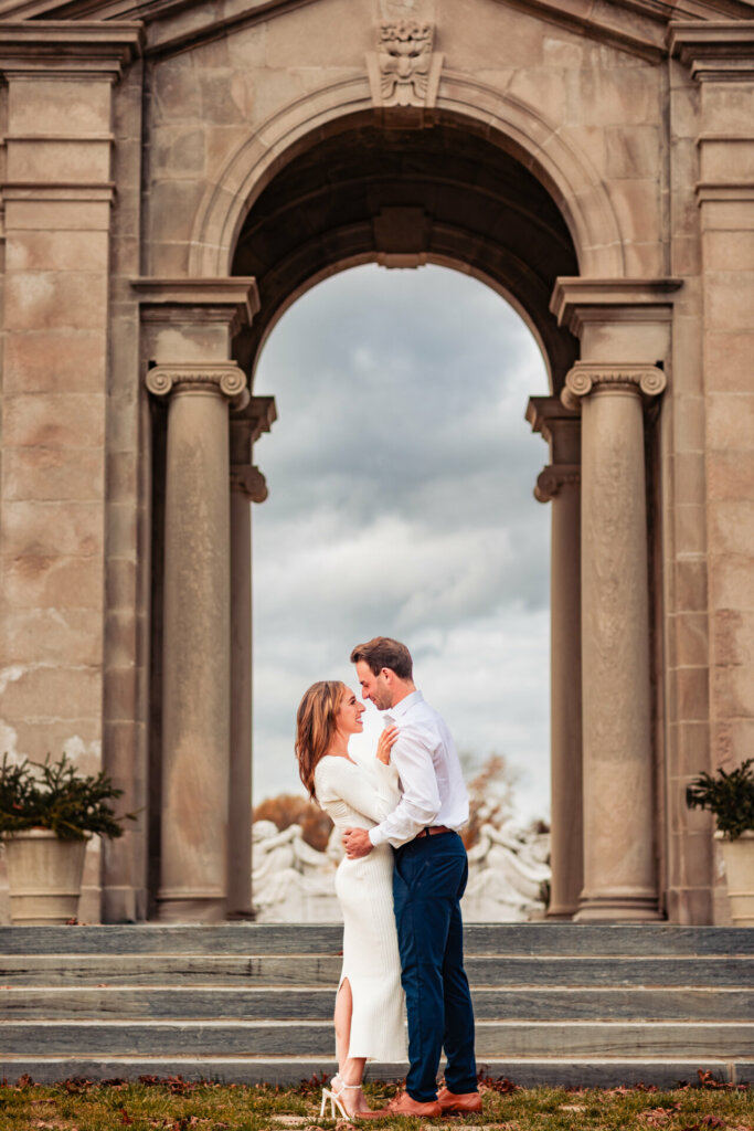 In this tender moment, the couple faces each other, their eyes locked in a gaze filled with affection and warmth. Sweet smiles adorn their faces, expressing the joy and love they share in this heartwarming connection on their Nemours State Engagement Photoshoot