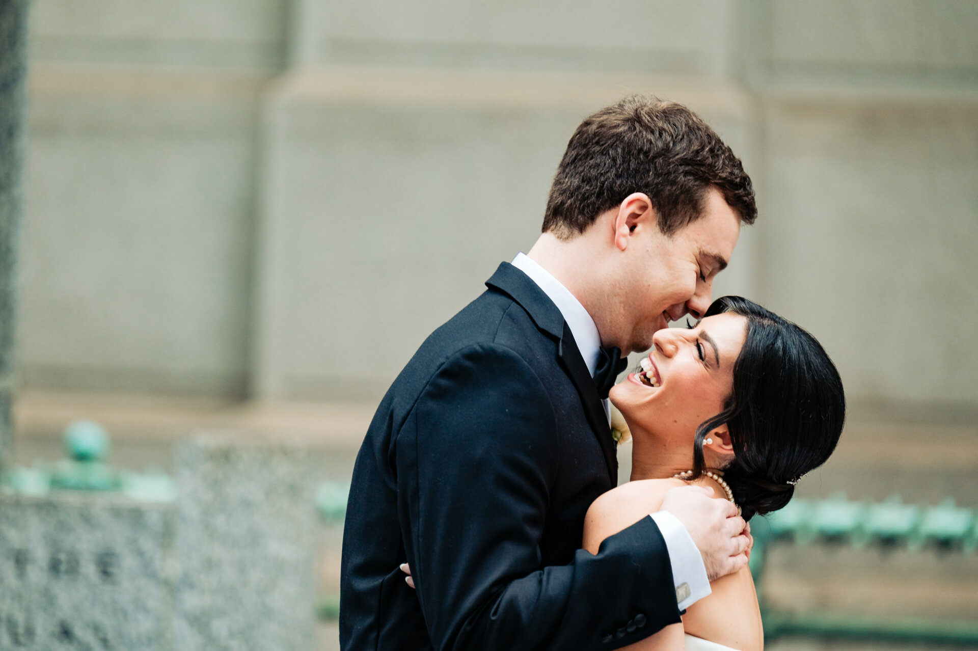 After their first look, the bride and groom share a lighthearted moment, laughter and joy filling the air as they bask in the happiness of the occasion before their wedding ceremony.