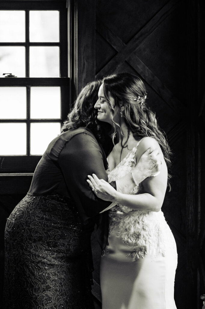 The bride and her mother share a heartfelt embrace