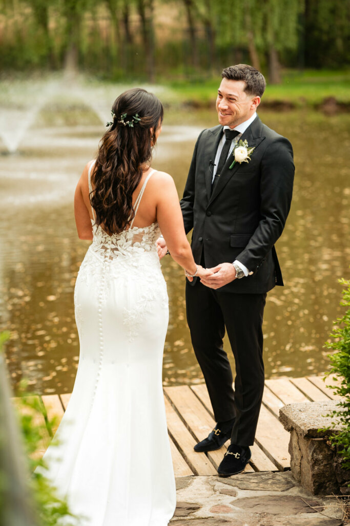 The bride and groom share a tender moment, their love palpable in the aftermath of their first look