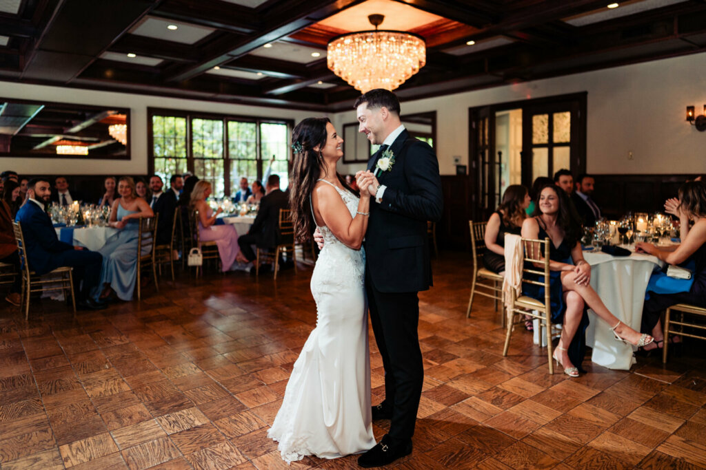 As the music swells, the newlyweds share their first dance, their movements graceful and intimate