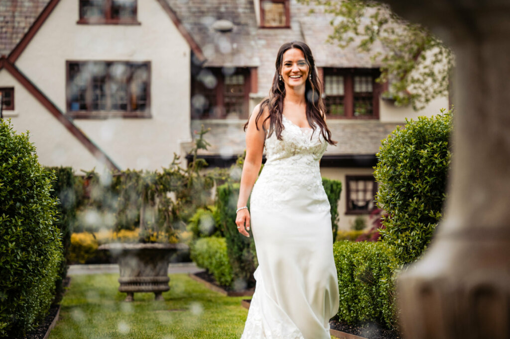 The bride radiates in a glowing close-up portrait, her beauty illuminated with a soft brilliance that captures the essence of her joy and anticipation on this magical day.