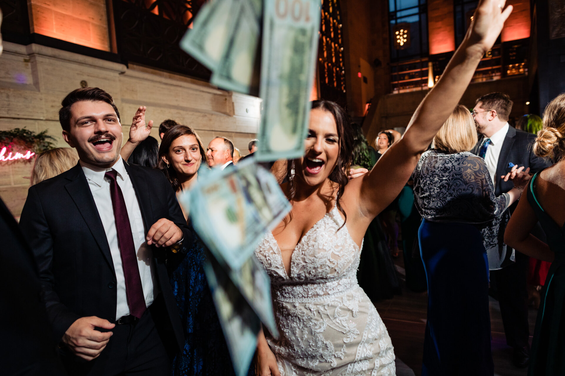 The newlyweds hit the dance floor, their joy contagious as they dance surrounded by their beaming guests, creating memories that will last a lifetime.