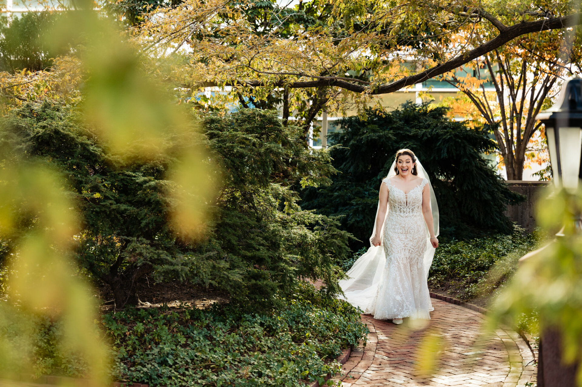 Bride surrounded by nature beams with joy as she shares her first look with the groom, capturing a heartwarming moment of love and anticipation