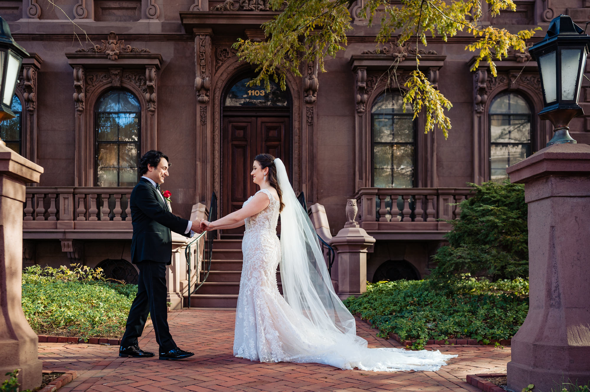 Excited bride and groom share a joyful moment during their first look.