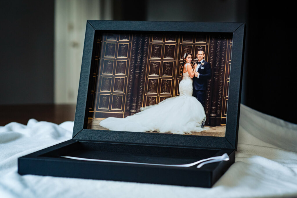 A beautiful keepsake box designed for preserving a wedding album features the engaged couple's portrait as the cover image.