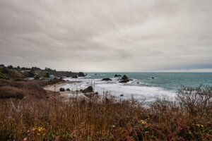 The Oregon coastline is dotted with sheer cliffs and rock formations.