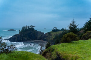 Along the Oregon coastline, majestic cliffs rise dramatically from the edge of the Pacific Ocean, creating a breathtaking backdrop of rugged beauty.