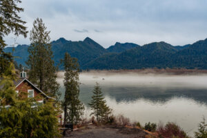 Within Olympic National Park, Lake Crescent offers a serene and picturesque vista surrounded by towering evergreen forests.