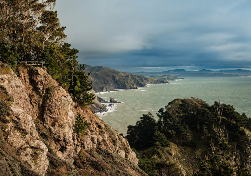 The view from Muir Beach Overlook in Muir Beach, California, is simply breathtaking. Perched atop the coastal cliffs, visitors are treated to an expansive vista of the rugged Northern California coastline.
