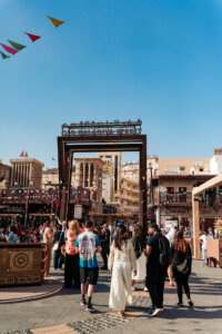 a flock of foreigners visiting the old dubai district
